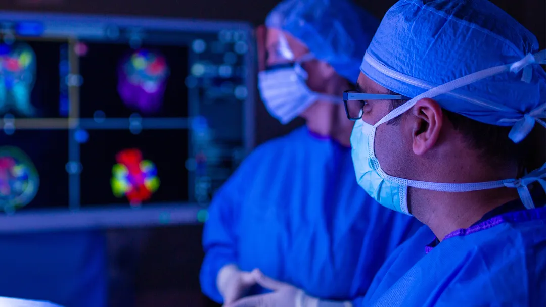 Neuro surgeon performing surgery.