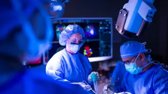 Neurology Physicians in lab performing surgery
