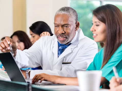 Physicians learning in a classroom.