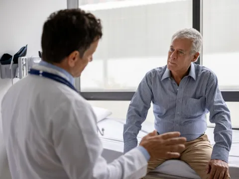 Doctor talking to a patient in a consultation at the office