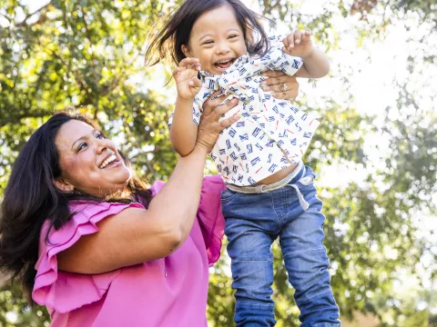 Woman playing with her child in the park