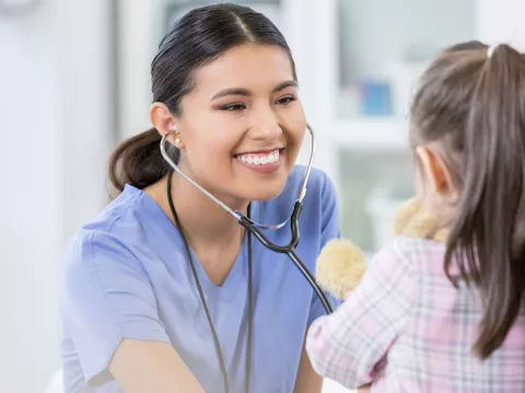 Doctor seeing a pediatric patient. 