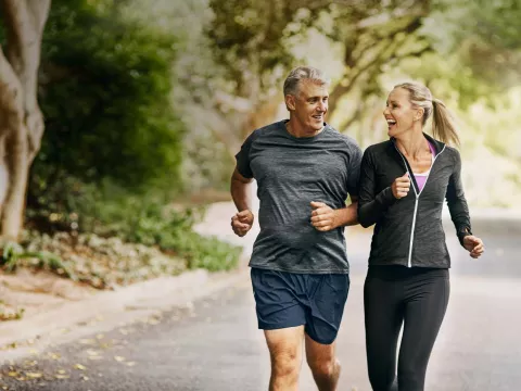 Man and woman jogging outdoors