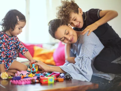 A mom playing with her kids.