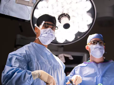 Two surgeons in the middle of a surgery