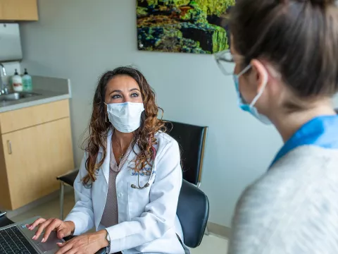 Physician talking with a patient.