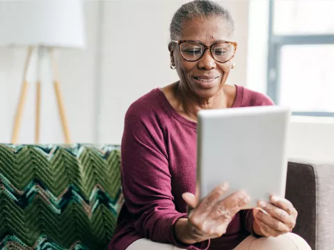 Woman reading tablet