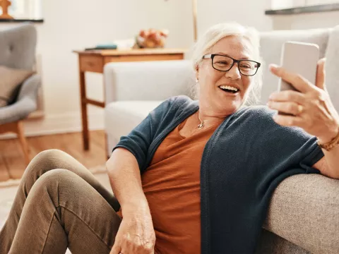 Woman taking a selfie with her living room.