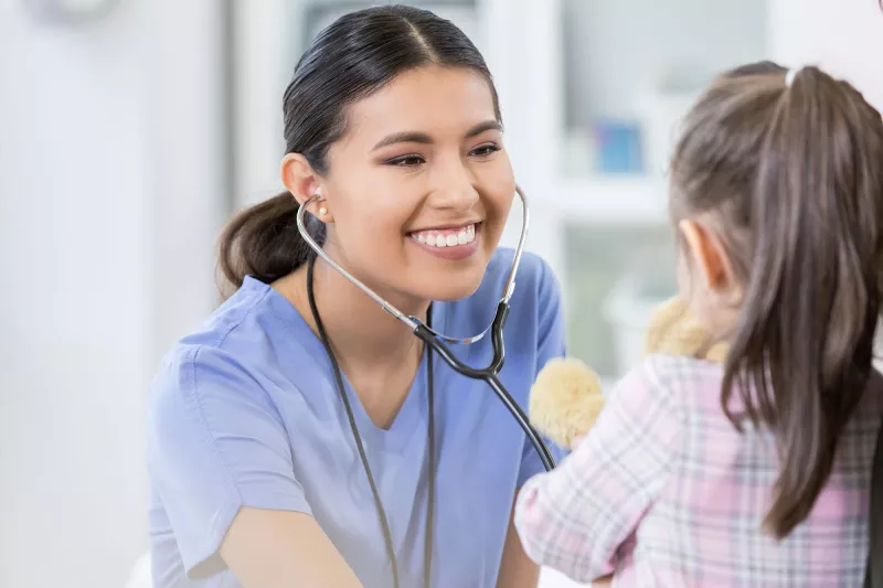 Doctor seeing a pediatric patient.