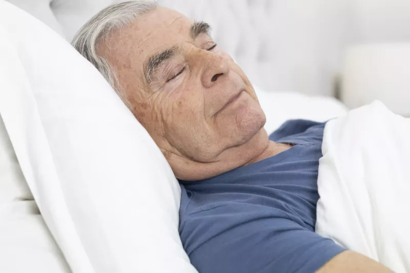 A man sleeps soundly.