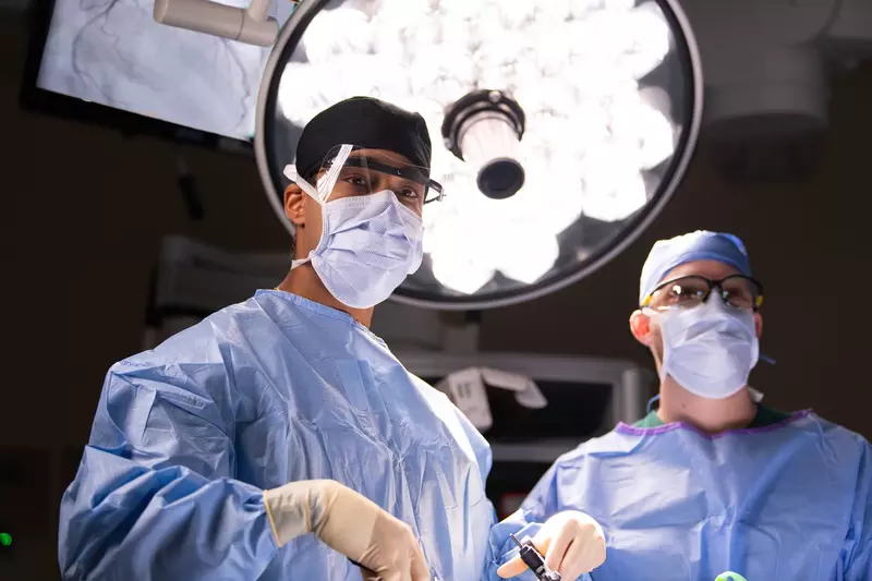 Two surgeons in the middle of a surgery