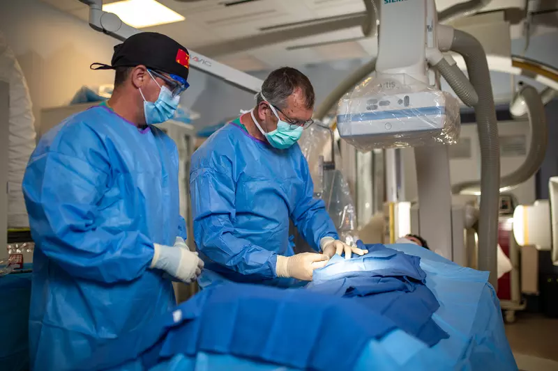 Neuro physicians performing Bi-plane procedure. 