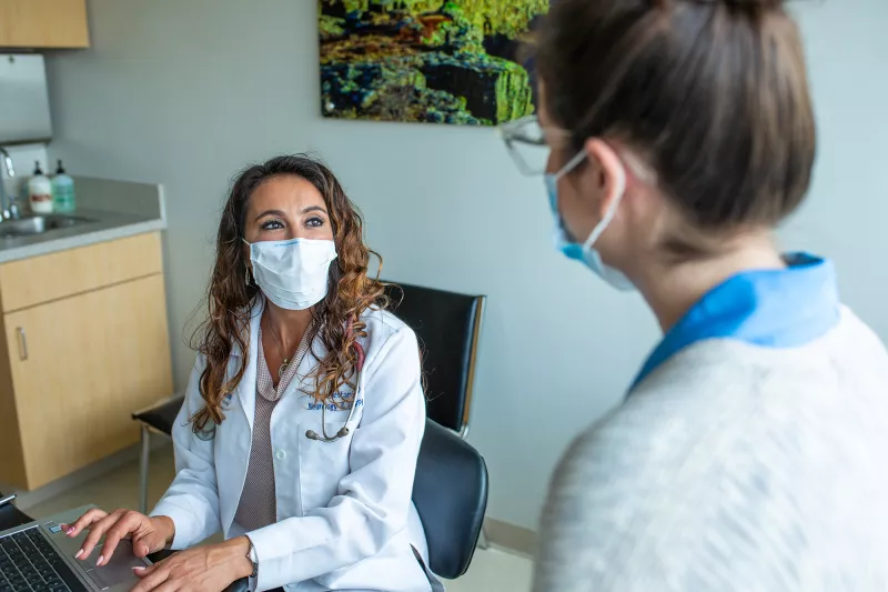 Physician talking with a patient.