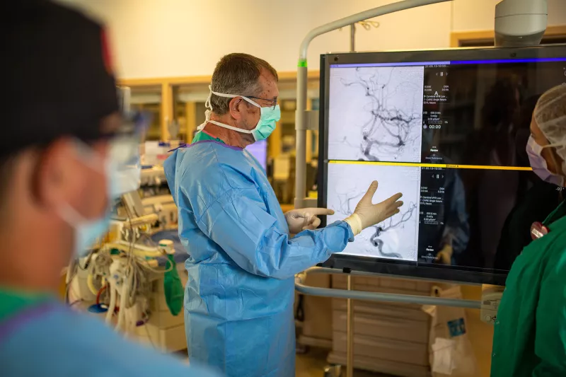 Physician discussing Bi-Plane Procedure.