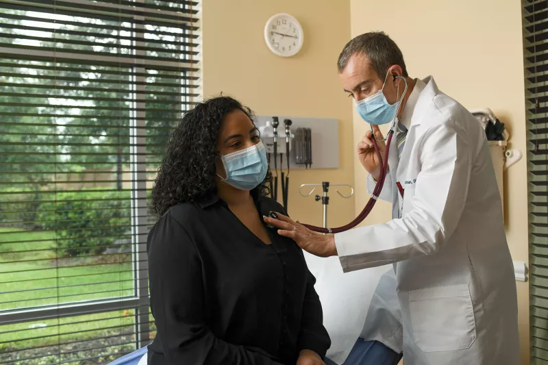 Patient in mask at appointment