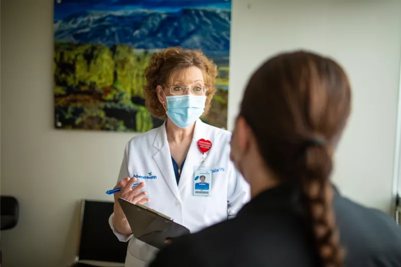 Physician talking with a patient.