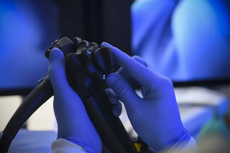 A surgeon's hands holding Endoscopy Equipment