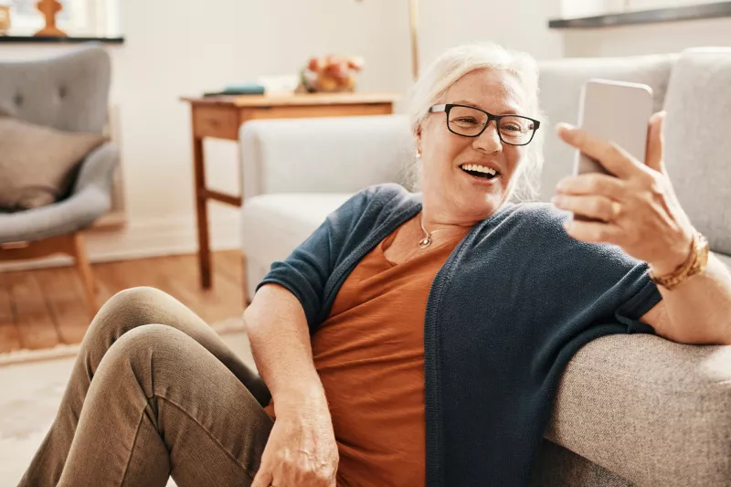 Woman taking a selfie with her living room.