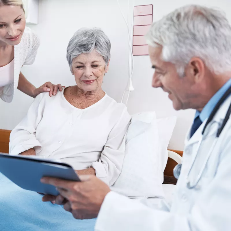 A doctor explains the procedure to a kidney transplant patient