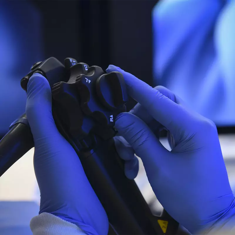 A surgeon's hands holding Endoscopy Equipment