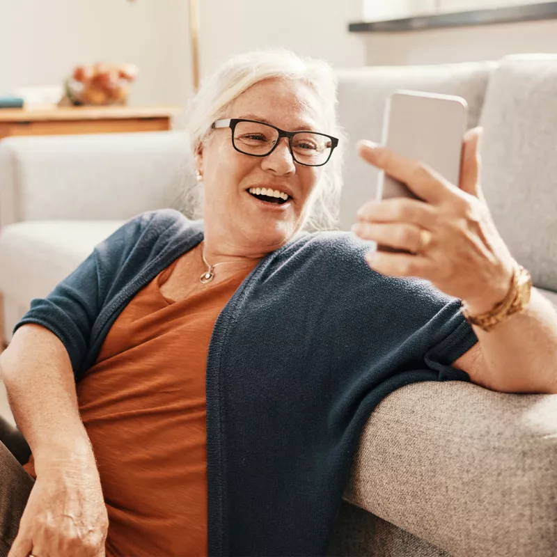 Woman taking a selfie with her living room.