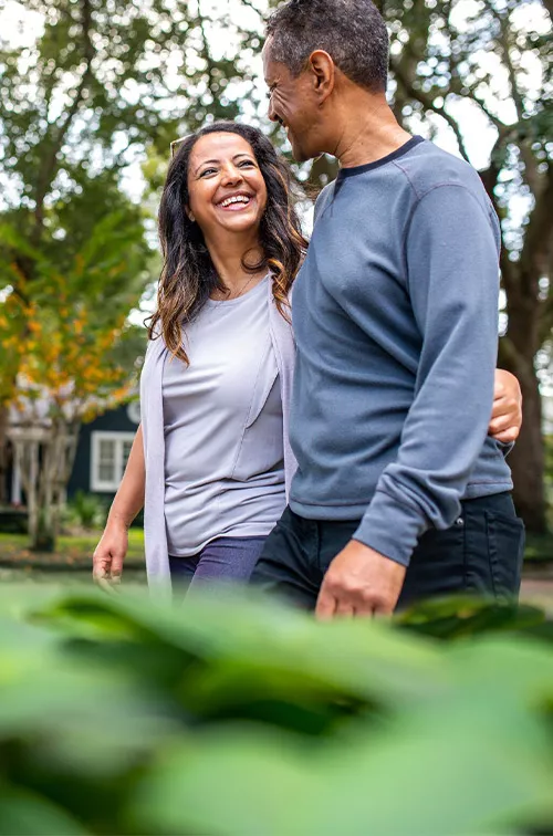 Man and woman walking in neighborhood